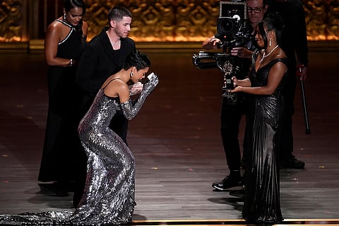 Nick Jonas and Adrienne Warren present an award